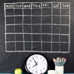 Grid timetable schedule on black chalkboard background