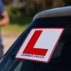 learner driver and instructor behind a car